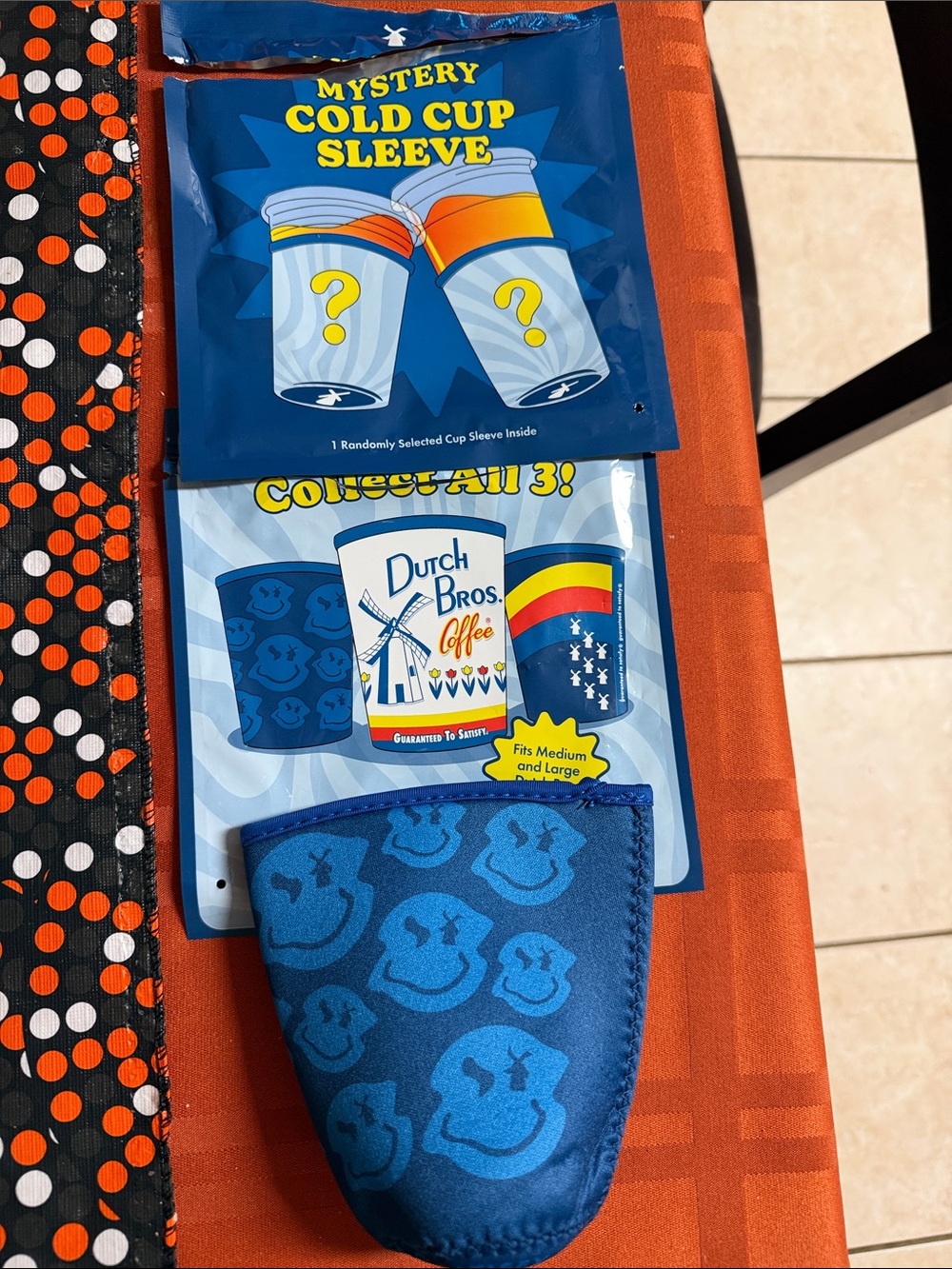 Dutch Bros Blue Mystery Cold Cup Sleeve with Smiley Pattern